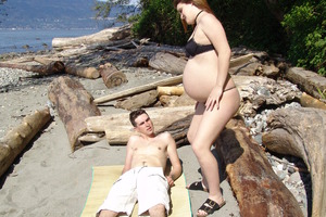 Pregnant cutie strips and shows you how horny she feels Image 3