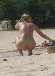 A tanned girl going topless on the Orient Image 5