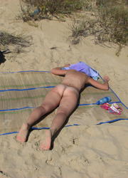 A busty bikini slut undressing on the Apollo Image 4