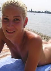 A busty bikini slut undressing on the Apollo Image 10