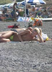 A busty babe at the Biarritz Image 1