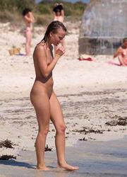 A busty bikini bitch undressing on the Clifton Image 9