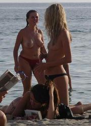 A slim and busty lady on the Trunk Bay Image 1