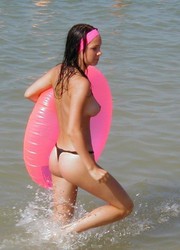 A slim girl posing on the Nugal Image 1