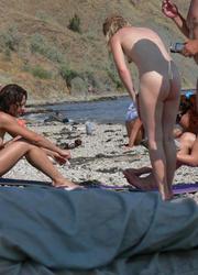 A bikini bitch going topless on the Biarritz Image 10
