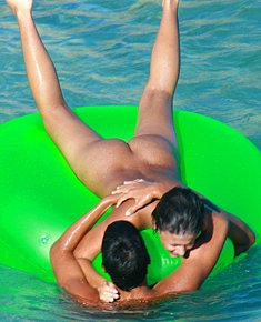 liberated beach teens warms naked vagina in the sun at the beaches of the Australia