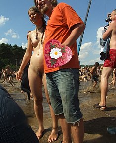 charming various teenage girls attracts men In the company of nudists on the beach