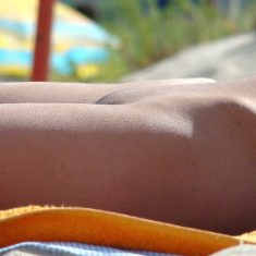 Voyeur photo of nude female on beach