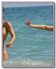 shapely nudists teenagers admires itself on a sandy beach