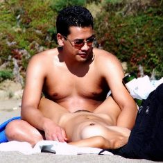 Voyeur photo of nude female on beach